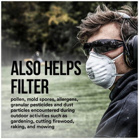 3M Safety respirator on a workbench beside fiberglass dust