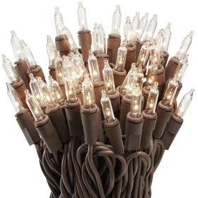 612 Vermont 100 clear mini lights on brown cord wrapped around a tree for outdoor ambience