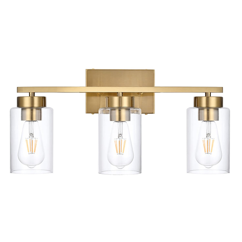 A1A9 3-light vanity fixture in brushed gold over a mirror provides warm, even illumination.