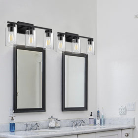A1A9 wall lamp complements mirrors and cabinets with clear glass detail.