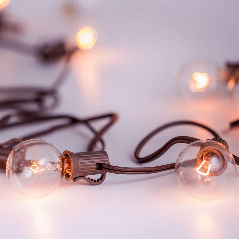 Abeja G40 clear globe bulb providing warm vintage ambiance.