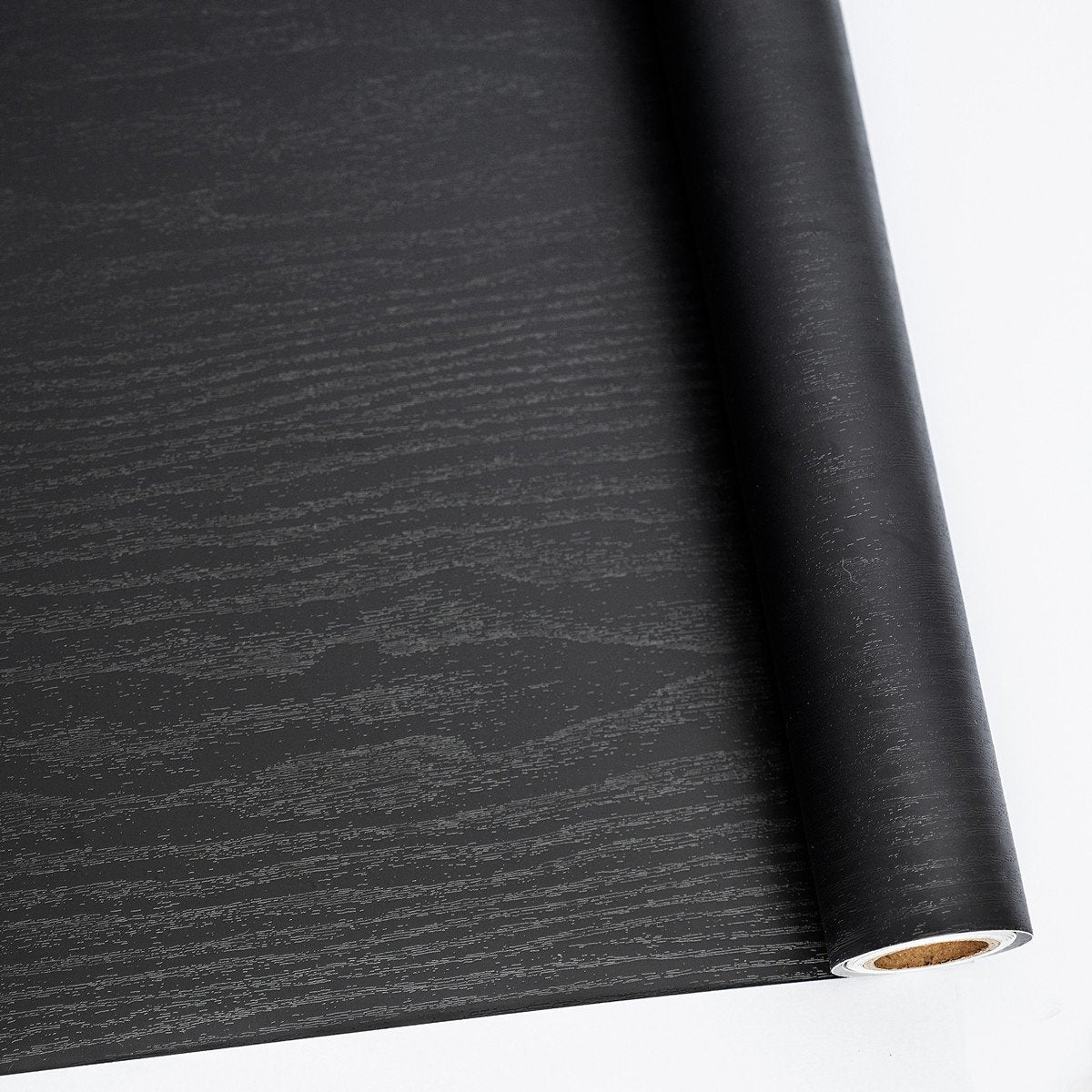 Abyssaly black wood peel and stick wallpaper roll for quick furniture refresh.