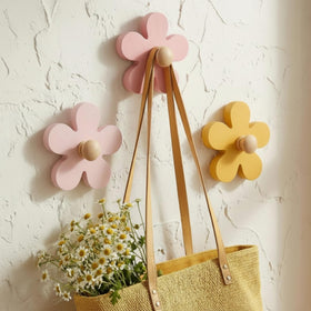 AceOrbit Daisy wall hook yellow front view, decorative and sturdy for towels and bags.