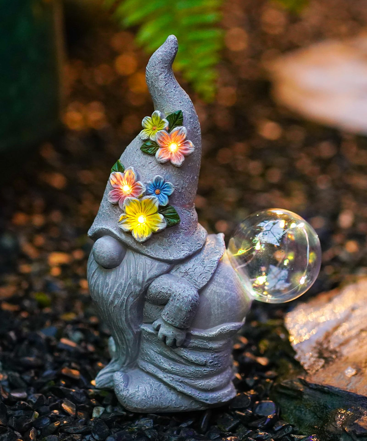 Acgarten solar funny garden gnome statue glows warmly outdoors.