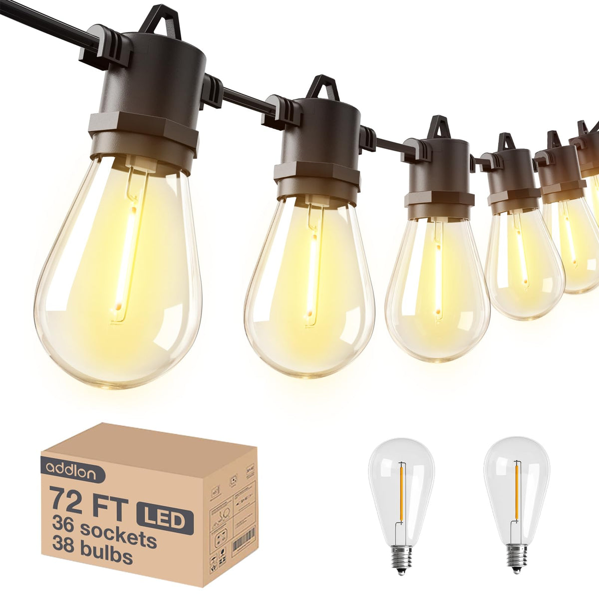 Close-up of Edison bulbs on Addlon string lights glowing warmly.