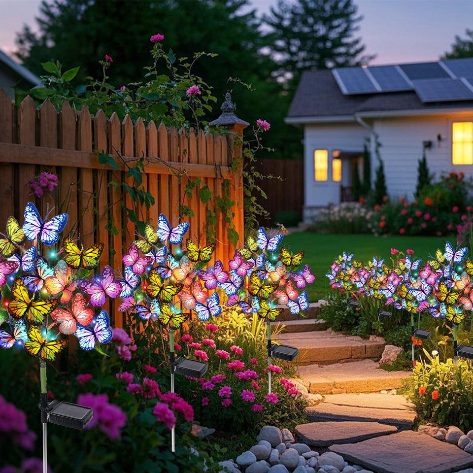 Adecorty 8-pack solar garden lights illuminate pathways with butterfly accents.