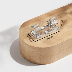 AFFAVON cord holder on shelf tidies data cables safely.