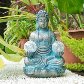 Afirst glass-ball Buddha statue adds subtle sparkle under sun and moonlight