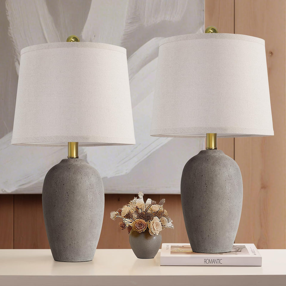 AIEAMPDO 21'' earth-brown ceramic lamp base adds rustic charm to a living room.