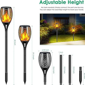 Aigleya Solar Flame Torch guides guests through a garden path with glow at dusk.