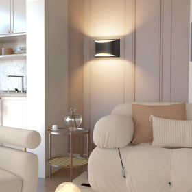 Aipsun black modern LED sconce in a living room setting adds cozy warmth.
