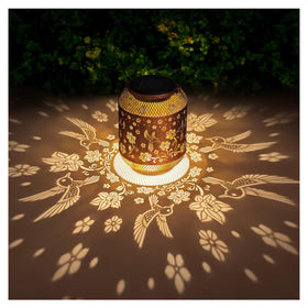 AITENISEN hummingbird solar lantern garden light emits warm glow for outdoor spaces