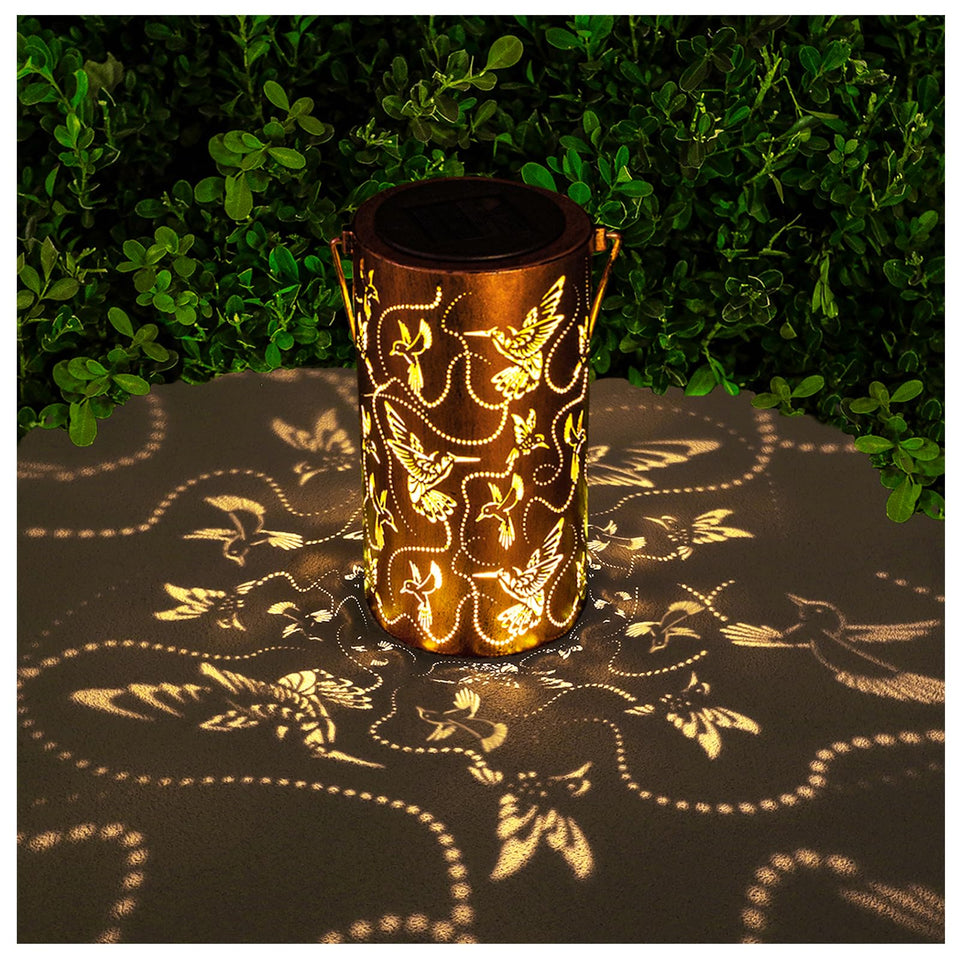 AITENISEN solar lantern with hummingbird decor on tree for warm outdoor ambiance.