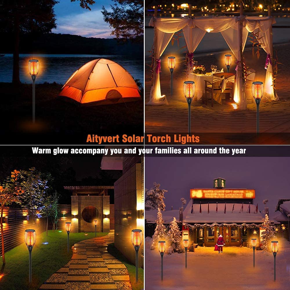 Aityvert night scene shows flickering flames creating warm outdoor ambiance.