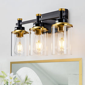 Aixialin 3-light bathroom fixture over mirror with black and gold finish; ideal for vanity tasks.