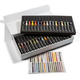 Markers arranged on a worktable for detailed miniature painting.