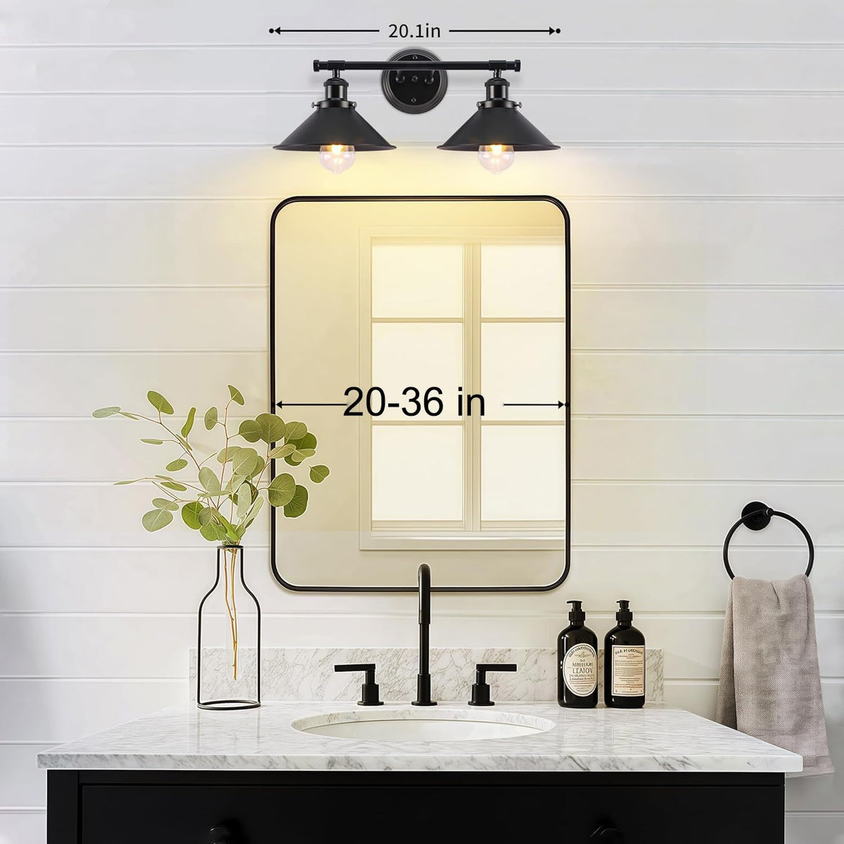 Alynzee vanity light over mirror in matte black for balanced room brightness.