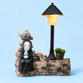 Amallino No Face Lamp on a bedside table adding cozy bedroom decor