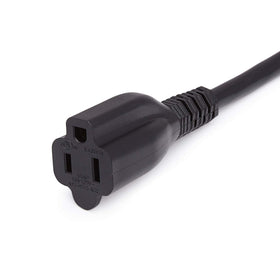 Black indoor extension cord in use with home electronics.