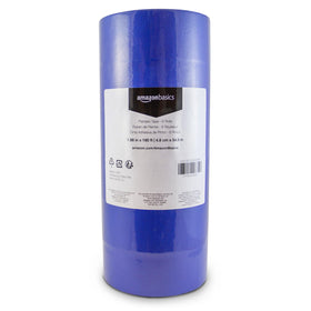 Amazon Basics blue painter's tape on wall creates crisp masking edge for clean lines