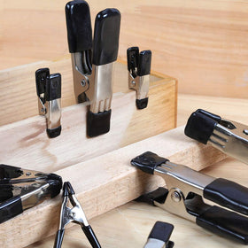 Amazon Basics clamps in use on a workbench for secure holds.
