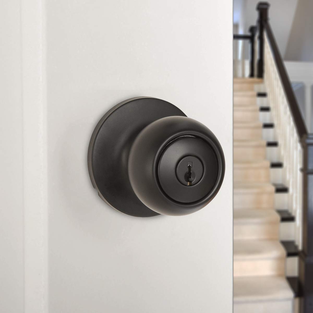 Amazon Basics coastal matte black faceplate and strike closeup illustrating rounded steel components.