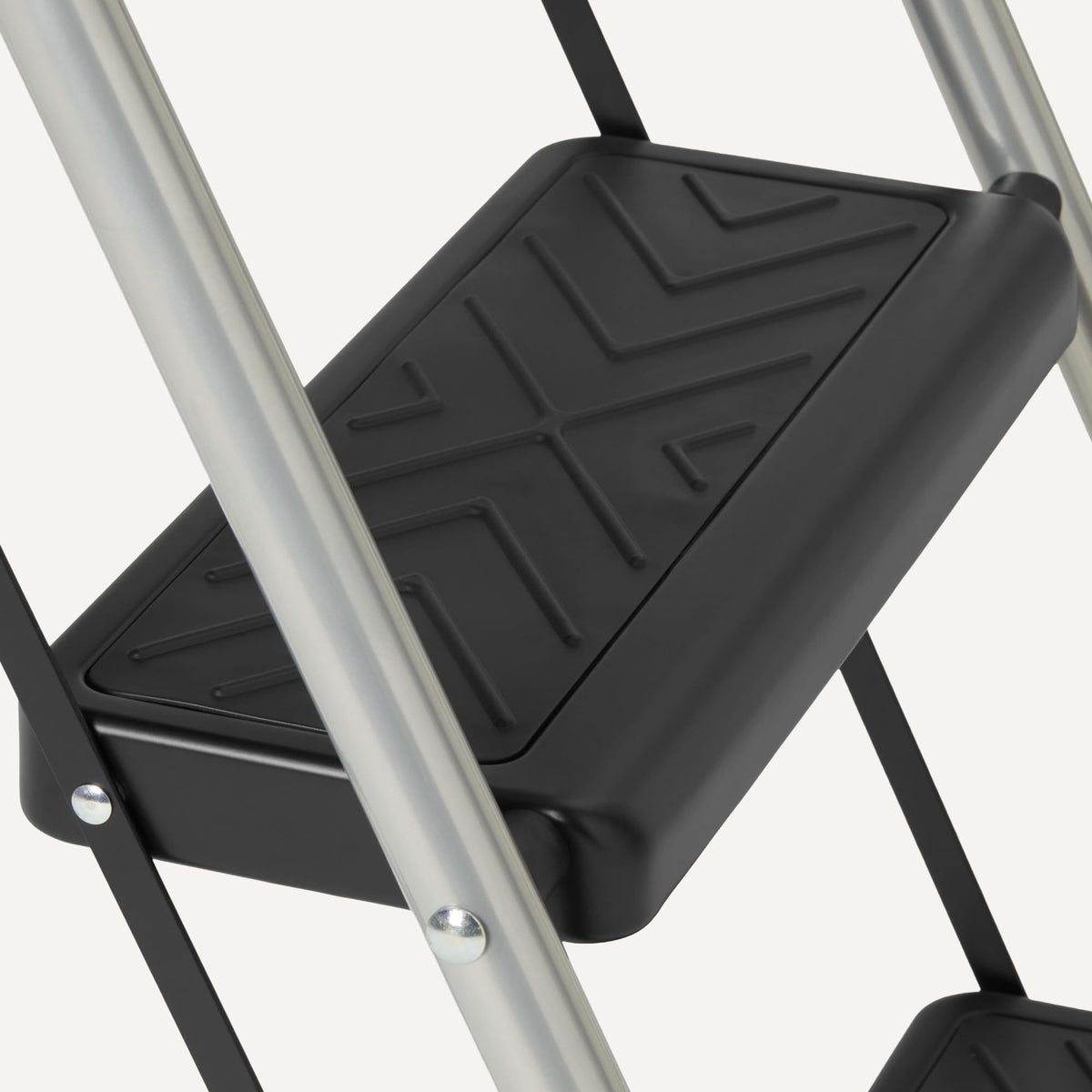 Amazon Basics folding ladder features a safety locking mechanism to stay secure during use.