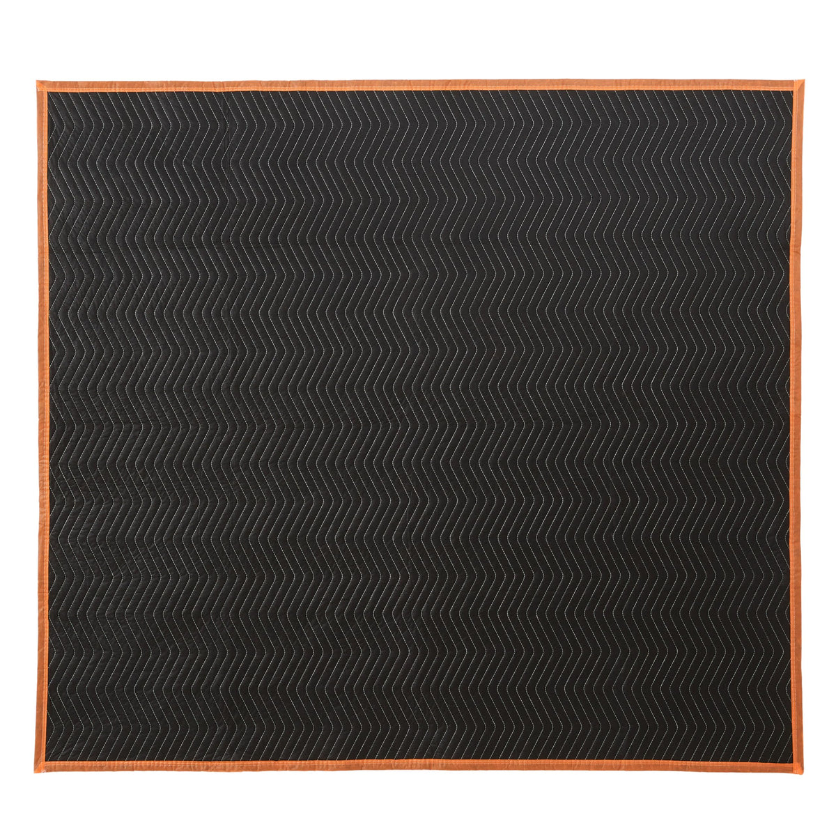 Amazon Basics moving blanket being used to wrap a piece of furniture for transport