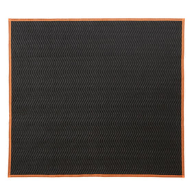 Amazon Basics moving blanket being used to wrap a piece of furniture for transport