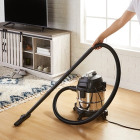 Amazon Basics stainless steel tank vacuum shown, built to endure repeated use on tough messes.