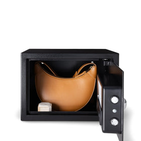 Amazon Basics steel security safe mounted to wall or shelf for stable placement.