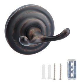 Amazon Basics zinc round hook in oil rubbed bronze mounted on wall for towels.