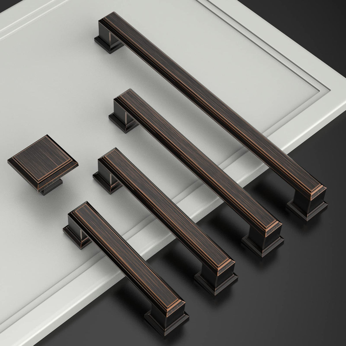 Amerdeco 5-inch hole centers pulls installed on a modern white cabinet.