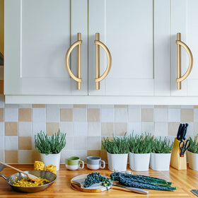 Amerdeco brushed gold cabinet pulls packaged securely to prevent scratches.