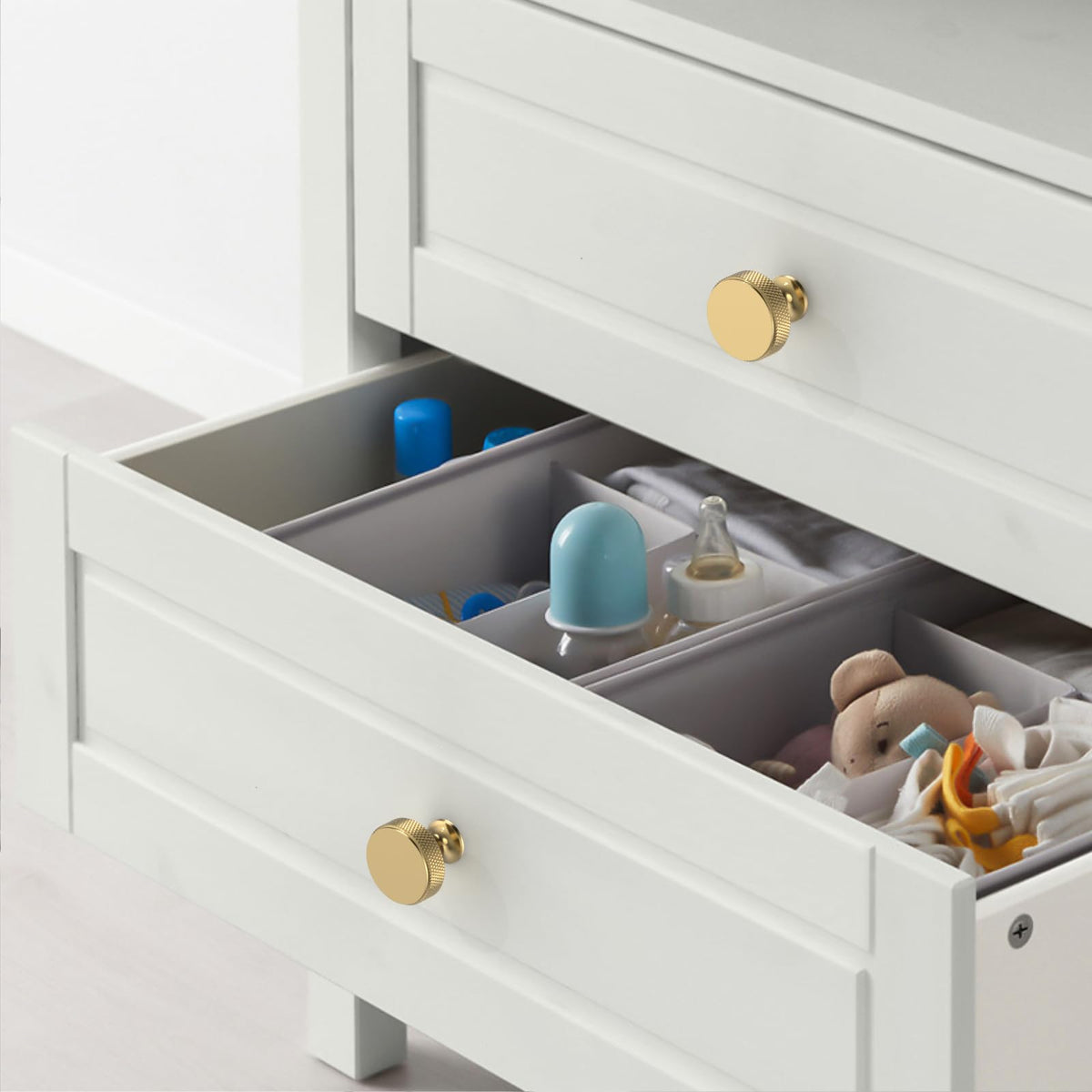 Amerdeco champagne bronze knob on cabinet doors with smooth finish and modern look.
