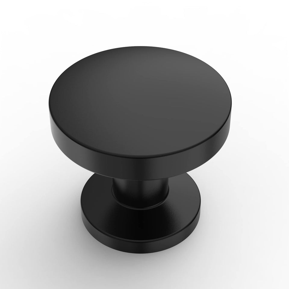 Amerdeco matte black cabinet knob close-up with protective packaging.
