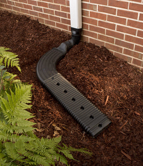 Amerimax StealthFlow 4631 connected to a downspout extension for efficient drainage.