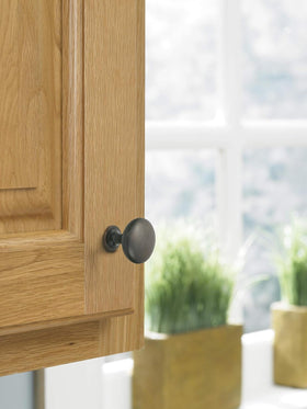 Amerock Edona close-up shows textured bronze finish with copper highlights.