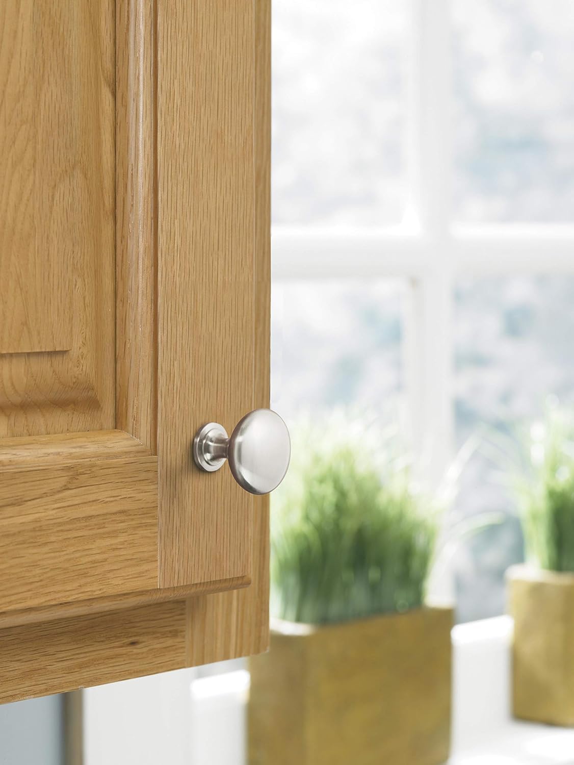 Amerock Edona knob satin nickel on a drawer for classic hardware