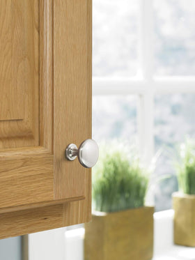 Amerock Edona knob satin nickel on a drawer for classic hardware