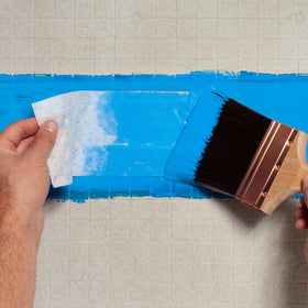 AMES Blue Max brush application demonstrates precise coating on basement walls.