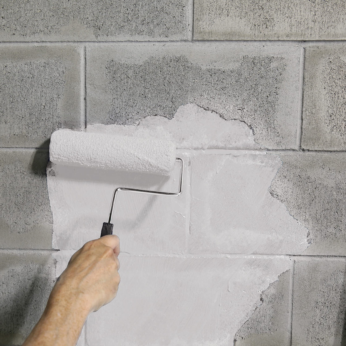 AMES Blue Max brush application on concrete showing versatile interior waterproofing
