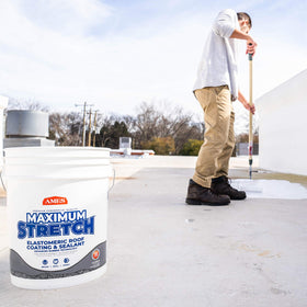 AMES Maximum-Stretch coating applied with a roller for quick coverage on large roof areas.