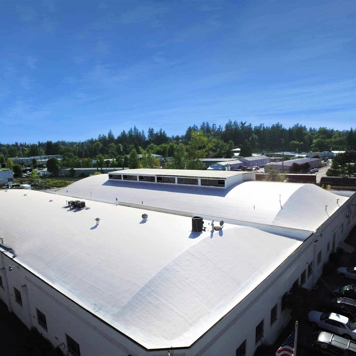 AMES Maximum-Stretch coating applied with a sprayer for even coverage.