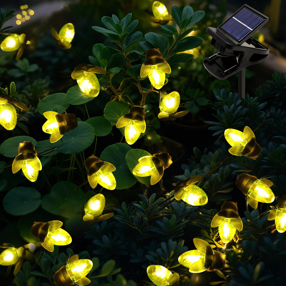 ANGMLN Solar Firefly Lights on a tree branch creating a magical outdoor glow