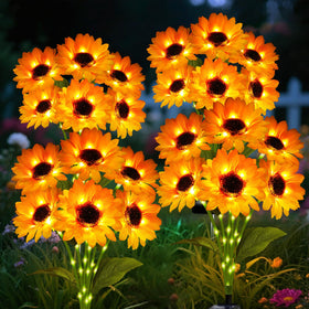 ANGMLN solar sunflower lights bouquet of six glows warmly along a garden path.