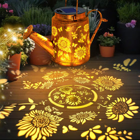 ANGMLN watering can lights cascade warmly along patios and walkways.