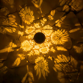 AnyTalk garden décor solar lantern brightens pathways at night.