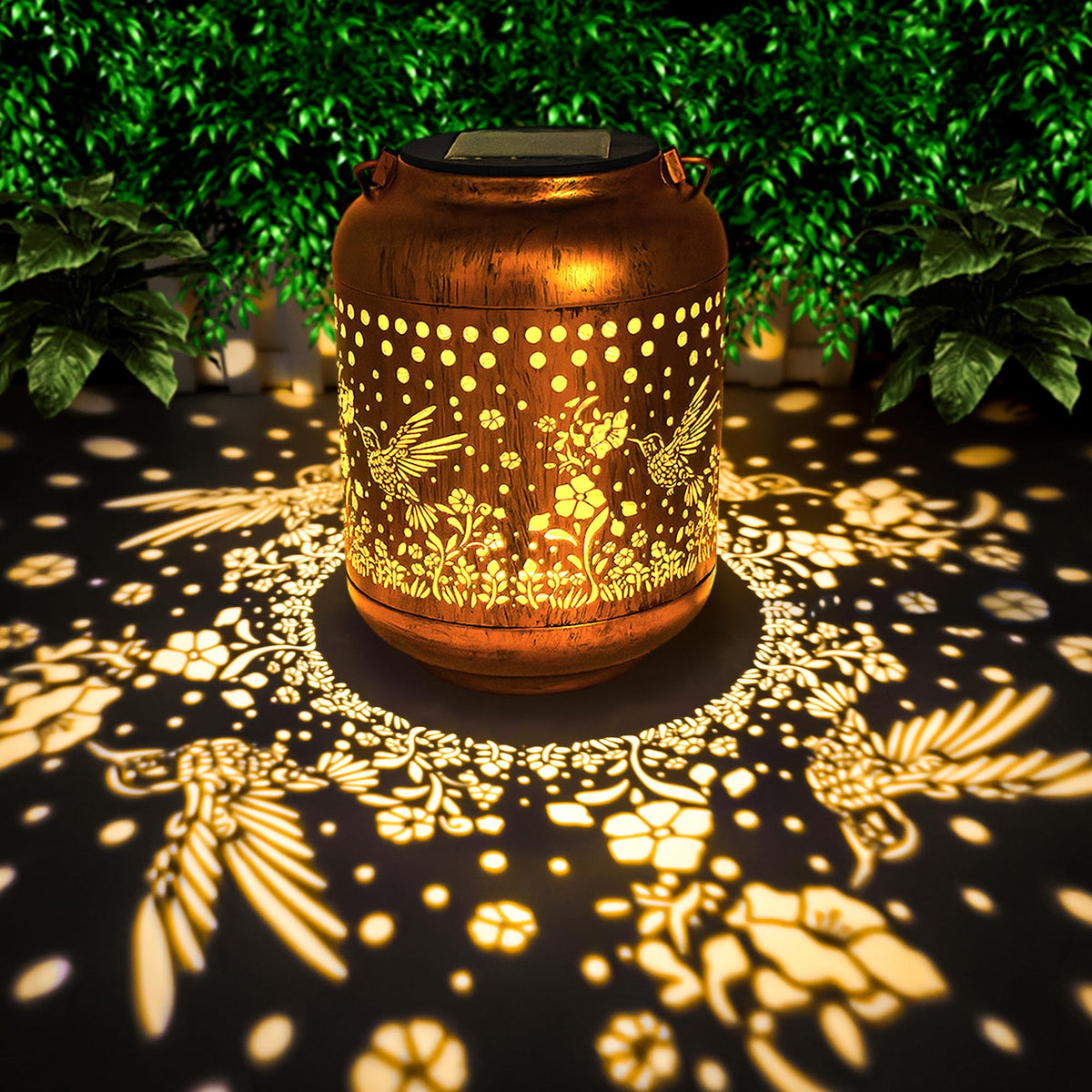 ANYTALK hummingbird wall-pattern lantern casts warm decorative light at dusk.
