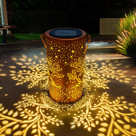 ANYTALK Tree of Life solar lantern hanging outdoors with warm glow for evenings